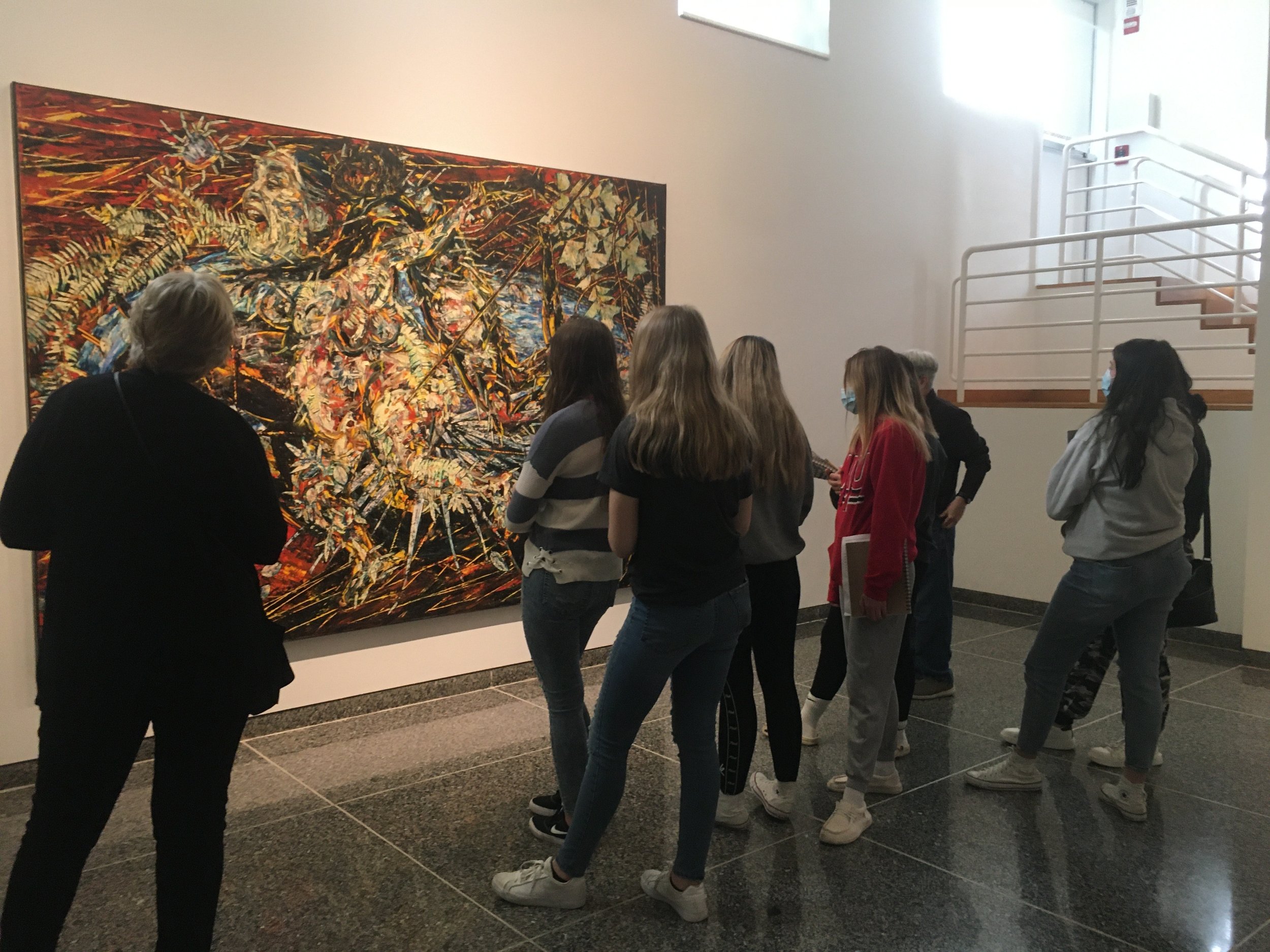 Students look at Hurricane from the south painted by Arnaldo Roche-Rabell