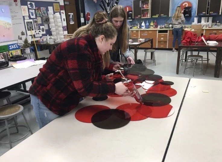 Students assemble their group sculpture