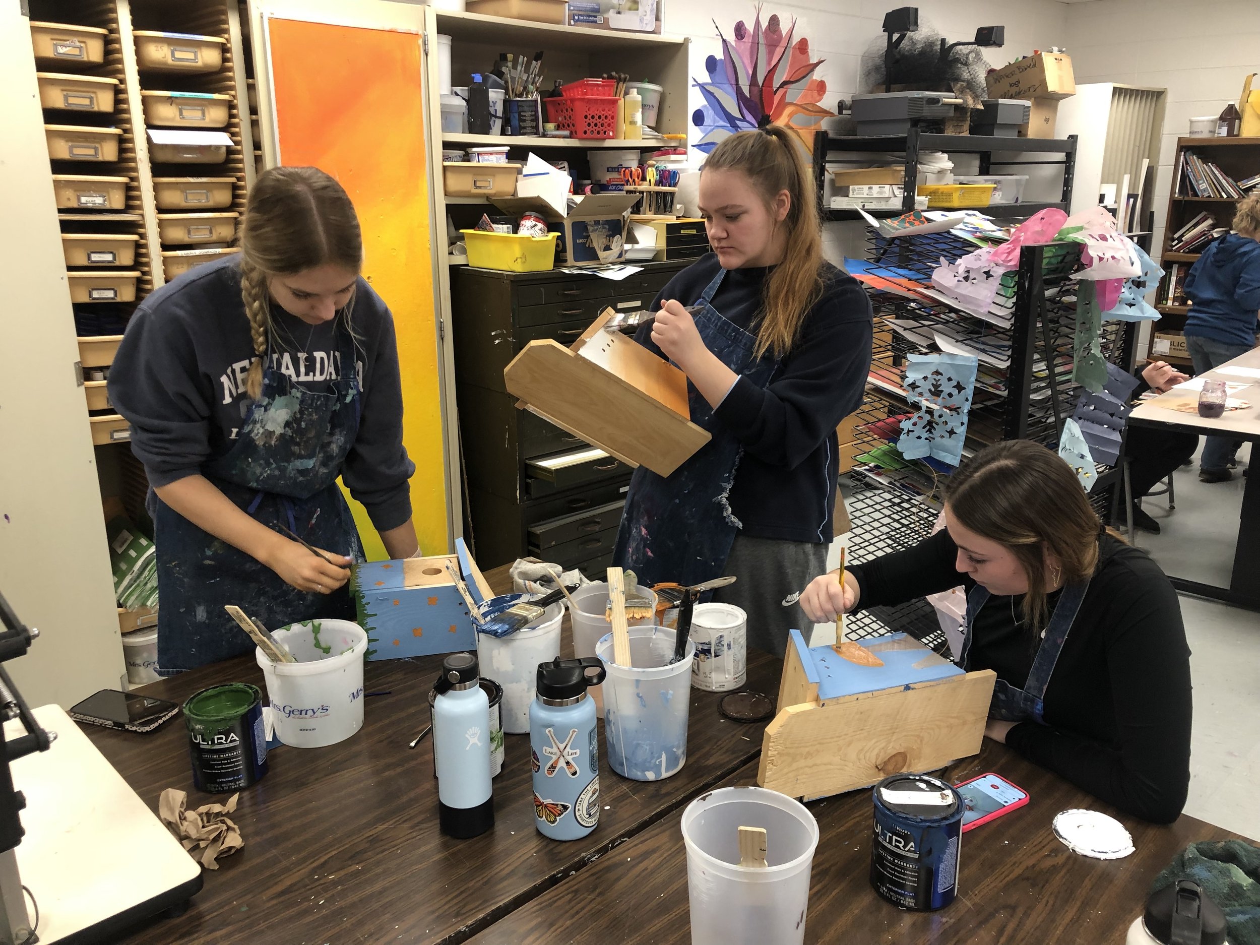 Senior students paint bluebird houses to be placed at Whiterock Conservancy, a local land trust of native oak savanna prairie.