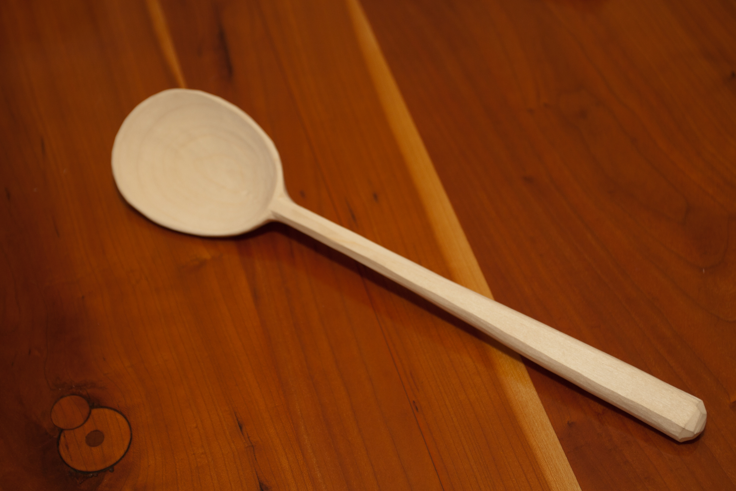 This design has a deeper bowl and more of a crank in the handle than the purist cooking spoons above. The edge of the bowl is relatively flat making these a nice hybrid cooking/serving spoon. 