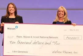 Accepting with the VP of RAINN a $10,000.00 check from Watson Pharmaceuticals to help fund RAINN services like its 24/7 Nationwide Rape Crisis Hotline