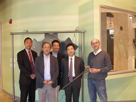 Lightweight deployable boom made of carbon fiber triaxial weave composite