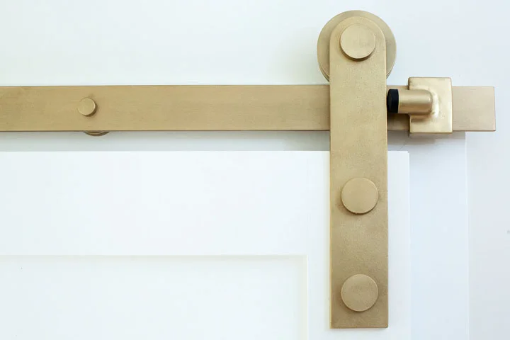 Barn Door Track in B1 Burnished Brass Finish . Photo: Kat Cannell Photography