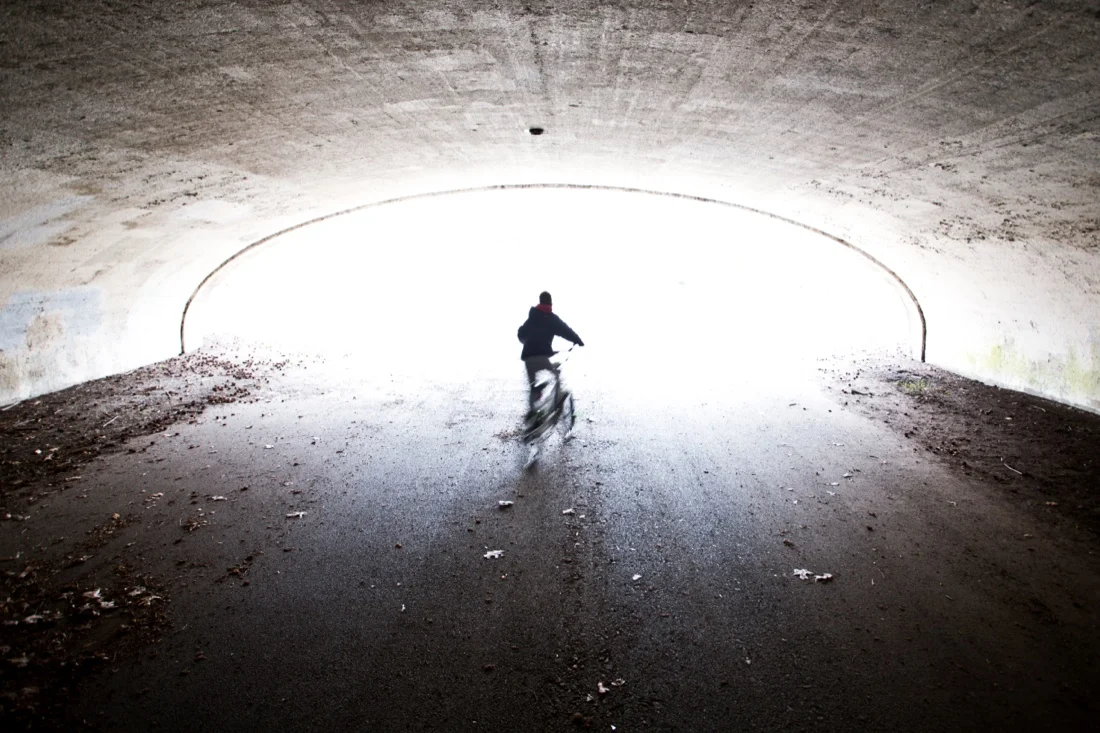 bronx; kids biking in tunnel silhoutte 4.jpg