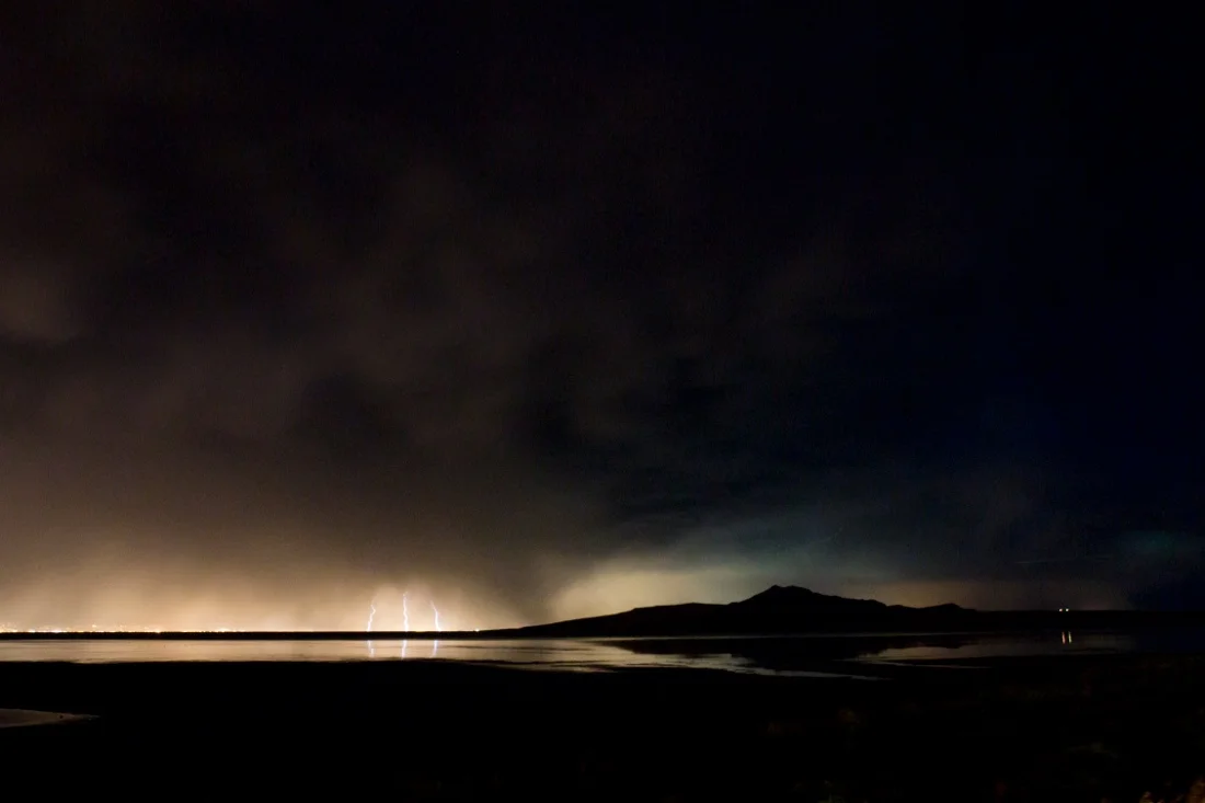 salt lake city utah 23; antelope island mountain silhouette lightning strike car headlights night.jpg