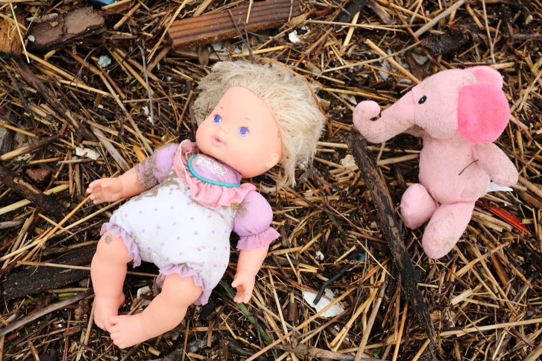 hurricane sandy aftermath in brooklyn 49; doll & stuffed animal on beach.jpg