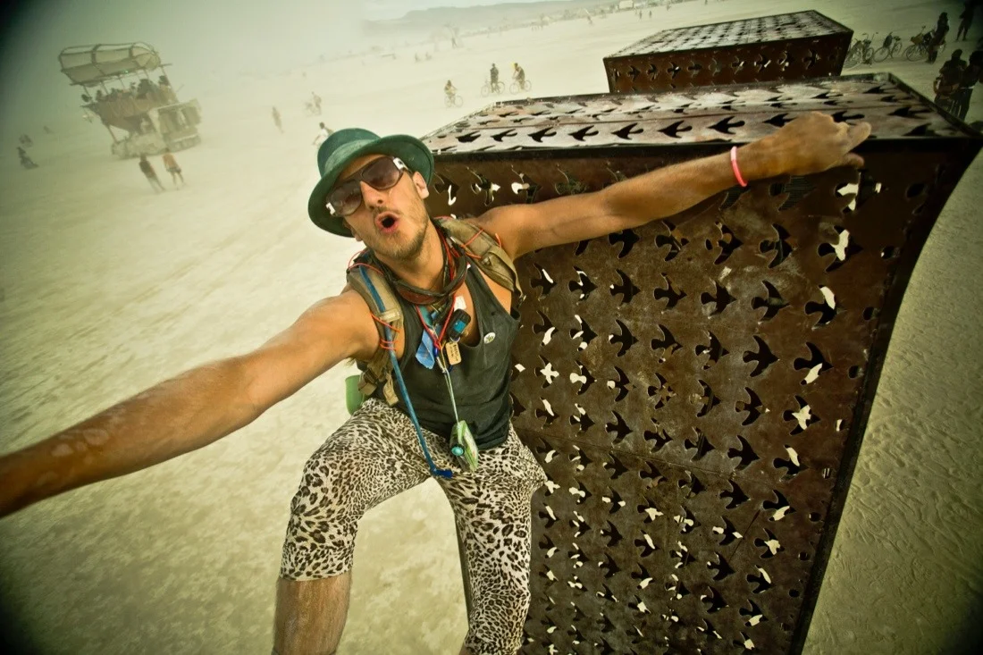 burning man 2014 44; laura kimpton & jeff schomberg love sculpture lane climbing.jpg
