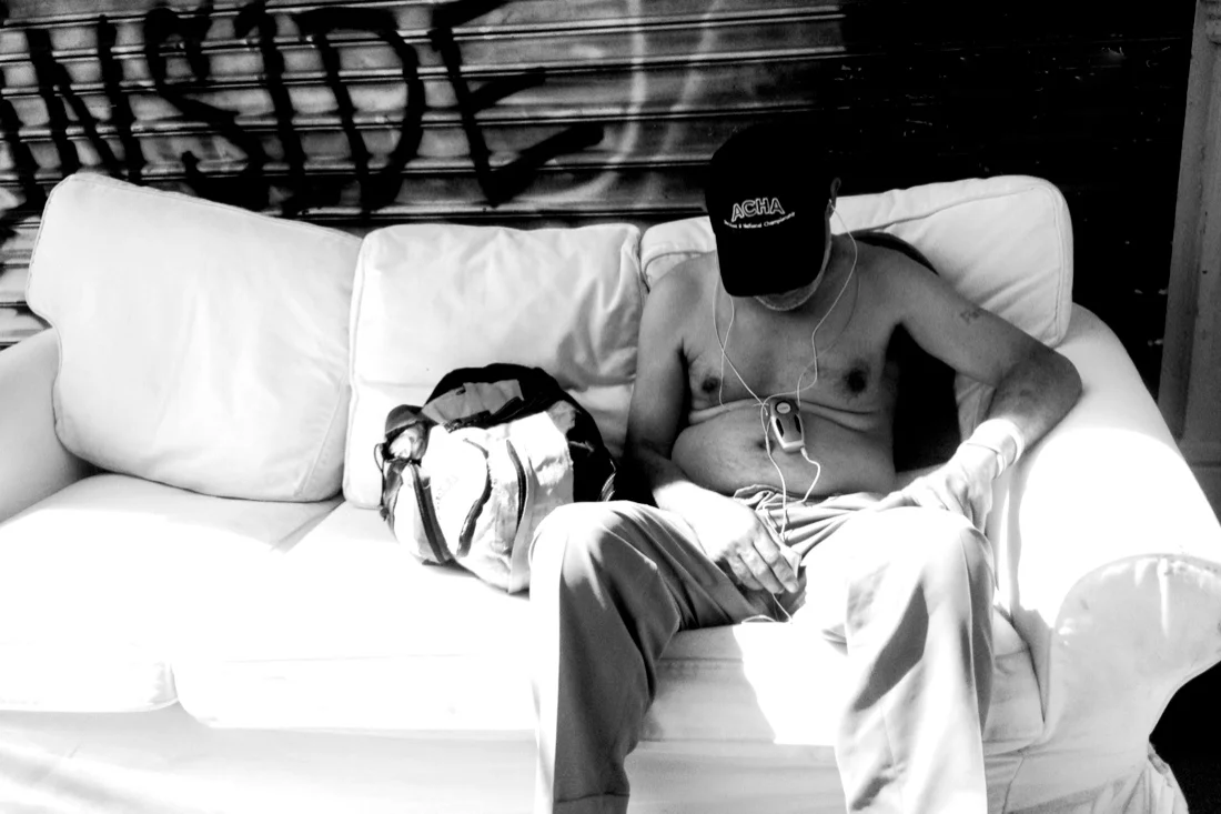 bum sleeping on couch black & white.jpg