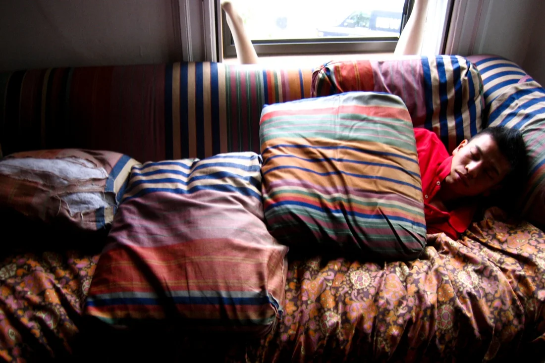 clem sleeping with pillows as blankets.jpg