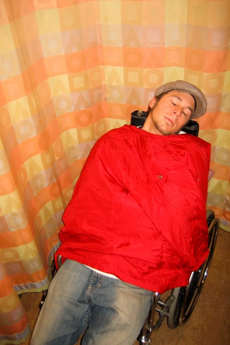mike in wheelchair sleeping.jpg