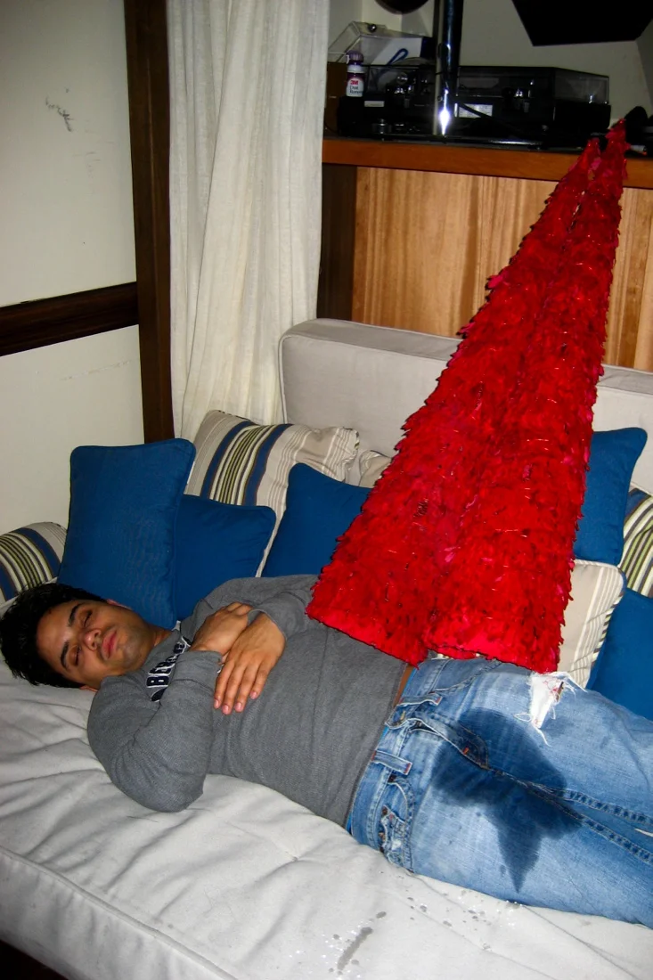 angel peeing on himself passed out with cones on top of him.jpg