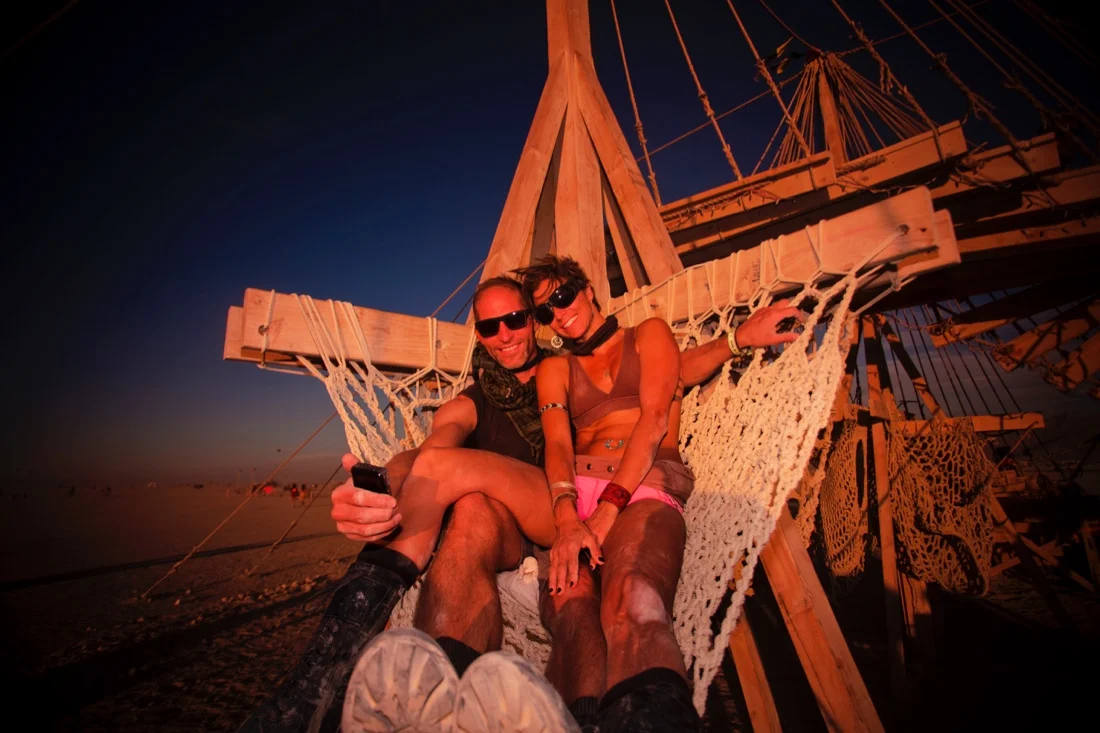 Burning Man 2015 92; Couple On Inflection Sunset Playa.jpg