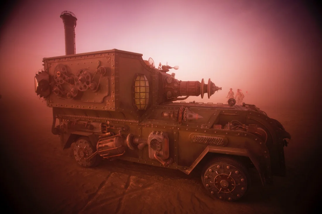 Burning Man 2015 152; Playa Dust Storm Steampunk Art Car Beamer Steamer Sunset.jpg