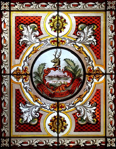 Vermont's state seal, in a stained-glass window in the State House, in Montpelier.
