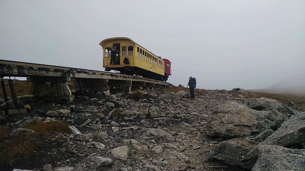 The Mt. Washington Cog Railroad goes by a hiker above the tree line. -- Photo by David W. Brooks