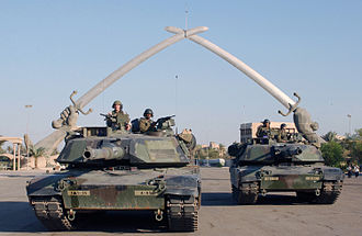 U.S. soldiers at the Hands of Victory monument in Baghdad during the invasion of Iraq in 2003.
