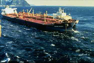 The Exxon Valdez, aground and leaking massive amounts of oil in Prince William Sound, Alaska.