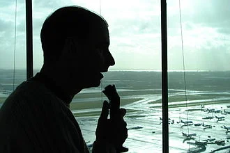 Air-traffic controller talking with pilots.