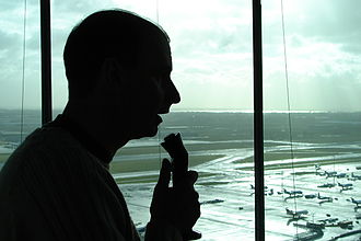 Air-traffic controller talking with pilots.