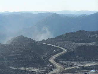 Cutting off the top of a mountain in Appalachia to get coal.