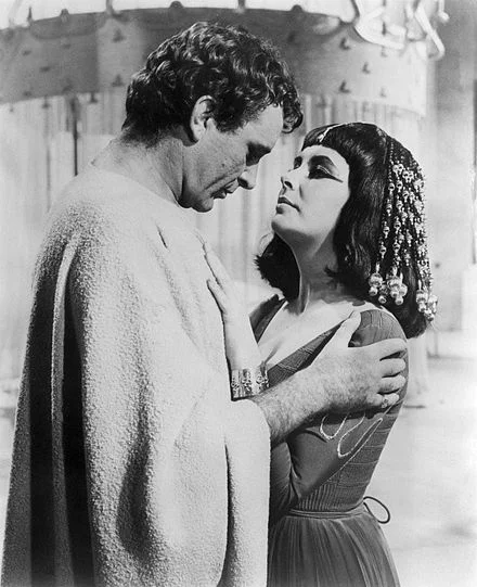 Richard Burton as Mark Antony with Elizabeth Taylor as Cleopatra in the film epic Cleopatra (1963), the project in which they started their off-screen love affairs.