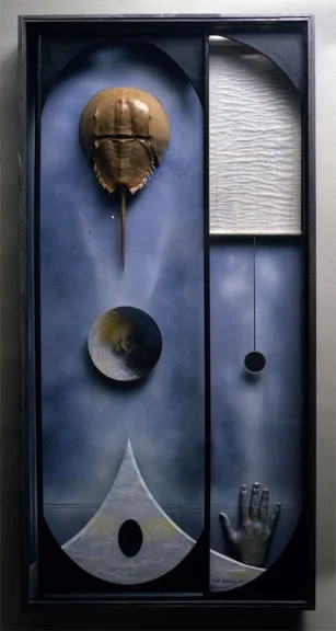 Elspeth Halvorsen, "Mermaid and The Horseshoe Crab'' (box construction), in her show "Constructions, '' at the Berta Walker Gallery, Provincetown, July 28-Aug. 19. The gallery says: " Elspeth Halvorsen's mixed media constructions balance expansion and containment, liberty and boundaries, filling her work with found objects gathered in surrealist assemblages. The group of assemblages in this exhibition were created throughout her career, focusing on minimal and abstract space and yin/yang balance. They create the sense of miniaturist surrealistic stage sets - or even temples - wherein her repeating symbols of moon, sphere/egg, mirror/ reflecting surface, draw our attention psychologically inward.'' 