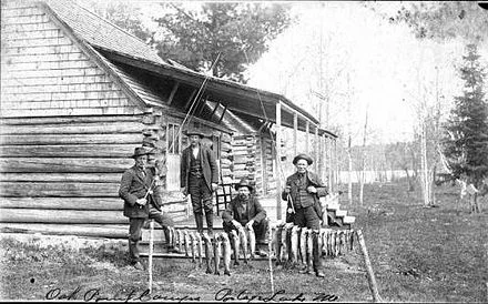 Successful fishermen at Oak Point Camps, Portage Lake, Maine, around 1900.
