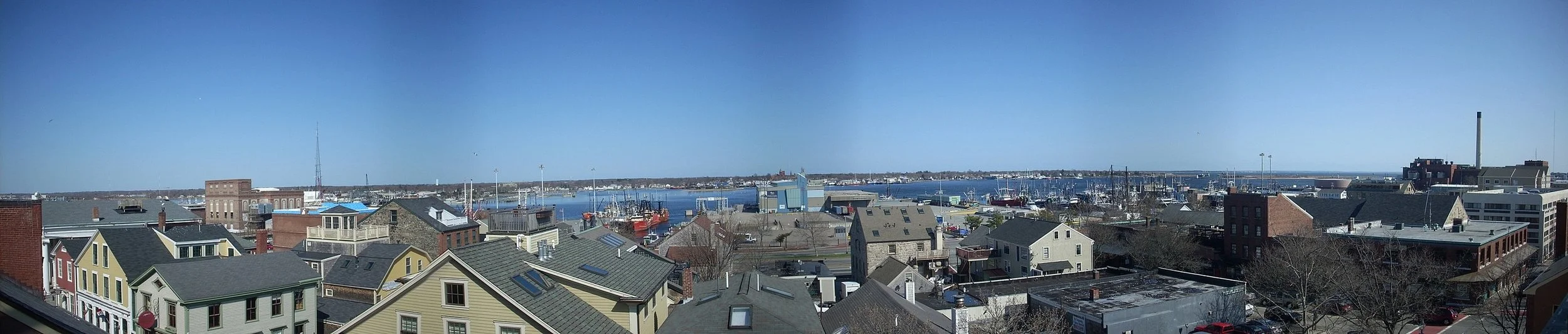 Looking over old houses and factories toward New Bedford Harbor. — Photo by Gerrydincher