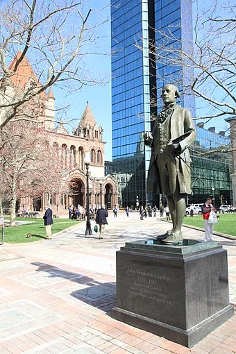 Statue of Anglo-American painter John Singleton Copley (1738-1815) in Copley Square. In the background is the Hancock Tower and Trinity Church.