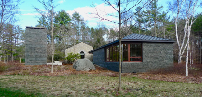 Outdoor fireplace, original library and new library.