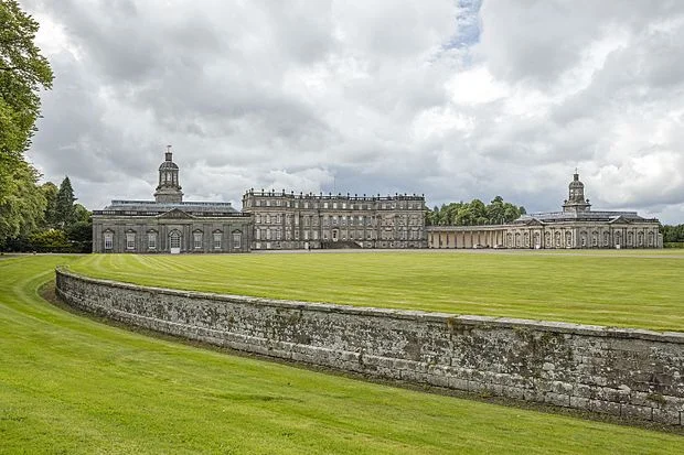 Ha-ha protecting the lawn at Hopetoun House , West Lothian , Scotland. Note how the wall disappears from view as it curves away to the left of the picture .