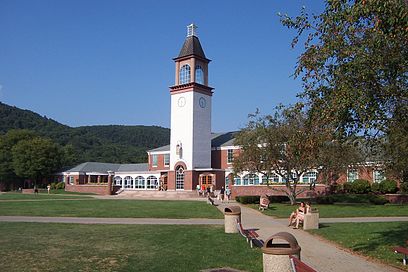Quinnipiac University’s Arnold Bernhard Library and clock tower, the focus of main campus quadrangle, in Hamden, Conn. Sleeping Giant Mountain is in the background. The author of this essay is a former president of the university.