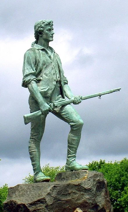 The Lexington Minuteman monument (1900), representing Massachusetts militia Captain John Parker in the Revolutionary War.