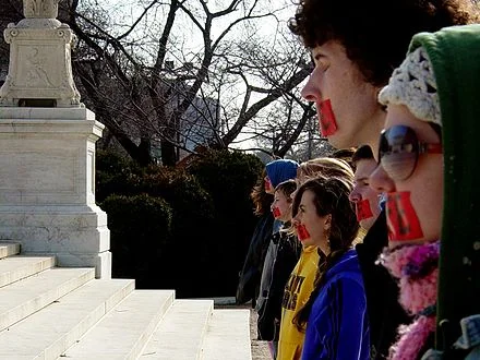 Members of Bound4LIFE in Washington, D.C. , symbolically cover their mouths with red tape in anti-abortion demonstration.