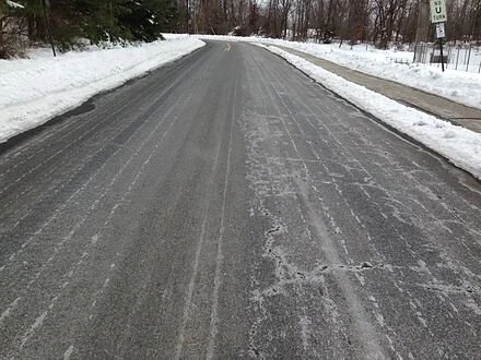 This road has been treated with salt brine.