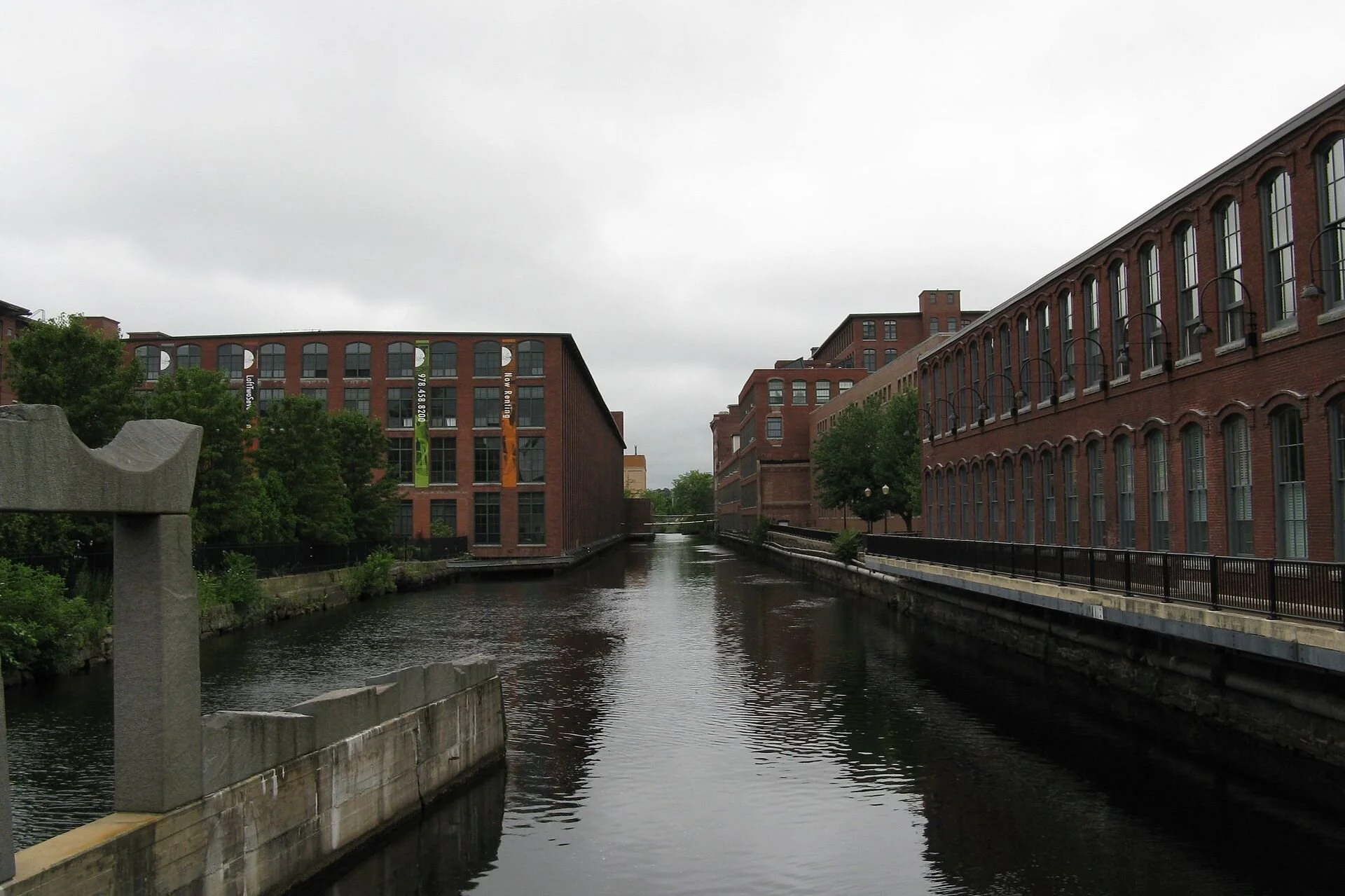 The Pawtucket Canal in Lowell, Mass., lined with old mill buildings— Photo by John Phelan