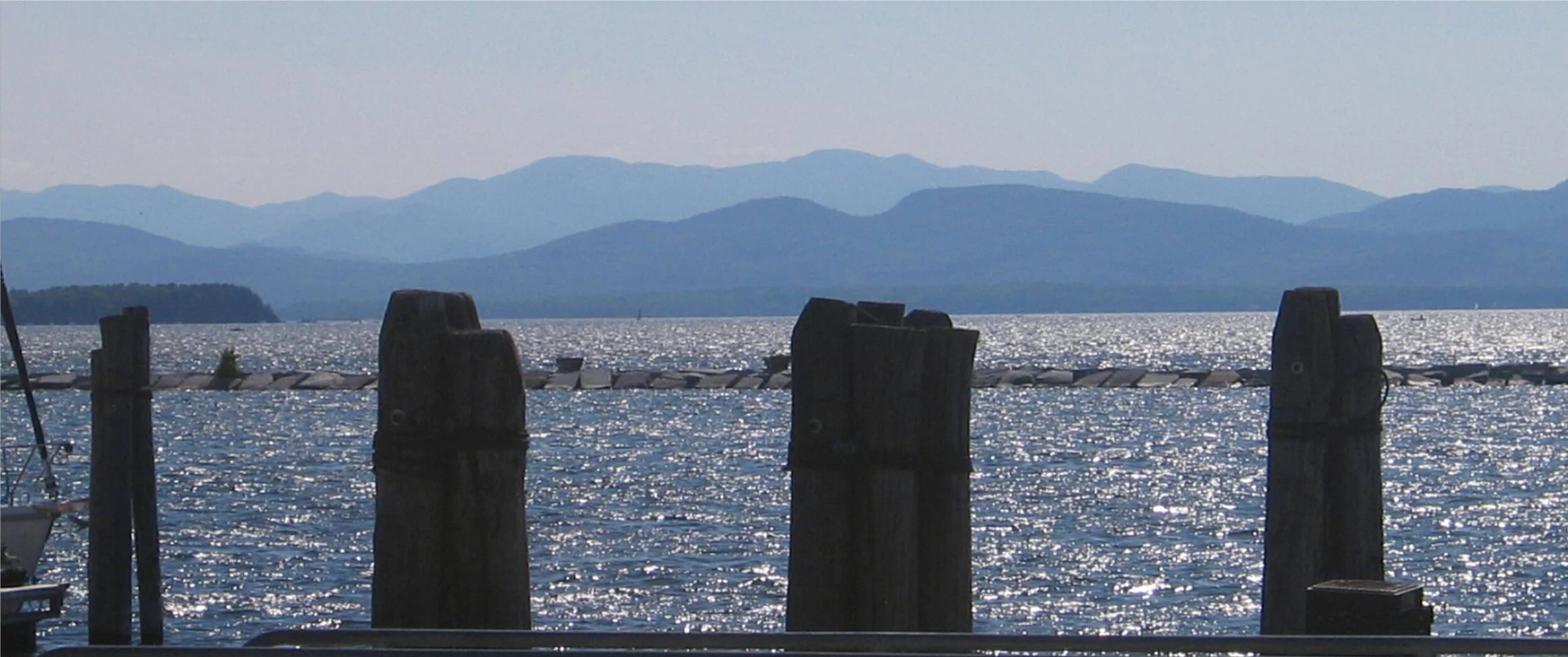 Lake Champlain from the Burlington docks, with the Adirondacks.— Photo by Jscarreiro
