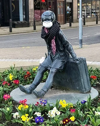 The "Wee Annie" statue, in Gourock, Scotland, has  a face mask during the pandemic.