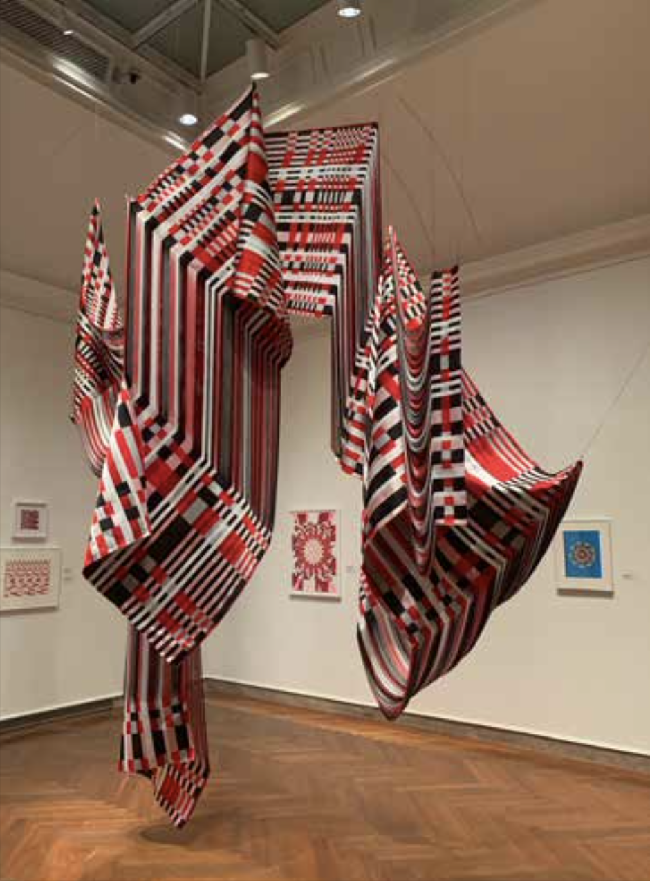 “Stretched Marker”  (woven silk yardage),  by Liz Collins, in the “current “Stretching Boundaries’,’ show at the Addison Museum of American at Phillips Academy, Andover, Mass.The gallery says:“An extraordinary collection of antique maps at Phillips …