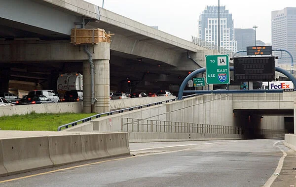 Boston traffic crawls over a closed Ted Williams Tunnel entrance in Boston during rush hour on July 11, 2006, the day after a tunnel collapse killed a passenger in a car.