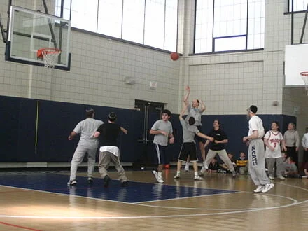 A faculty member takes a shot in the 2006 Maimonides School faculty vs. senior class basketball game — an annual tradition proceeds from which are donated to charity.