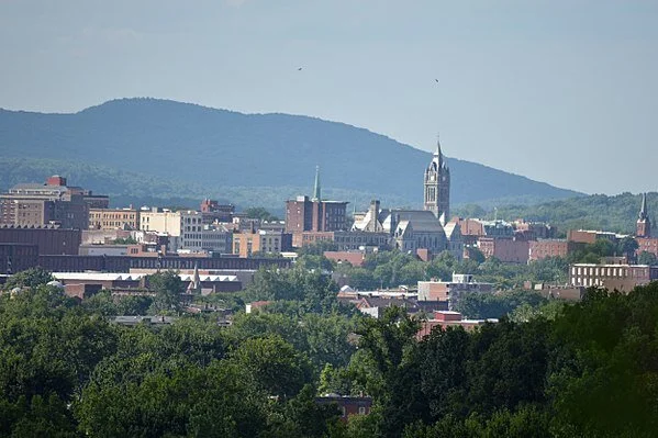 The New England electric grid is managed by ISO New England from Holyoke, Mass., whose skyline  is seen here. Note the clock tower of City Hall and the Mount Tom Range in the background,