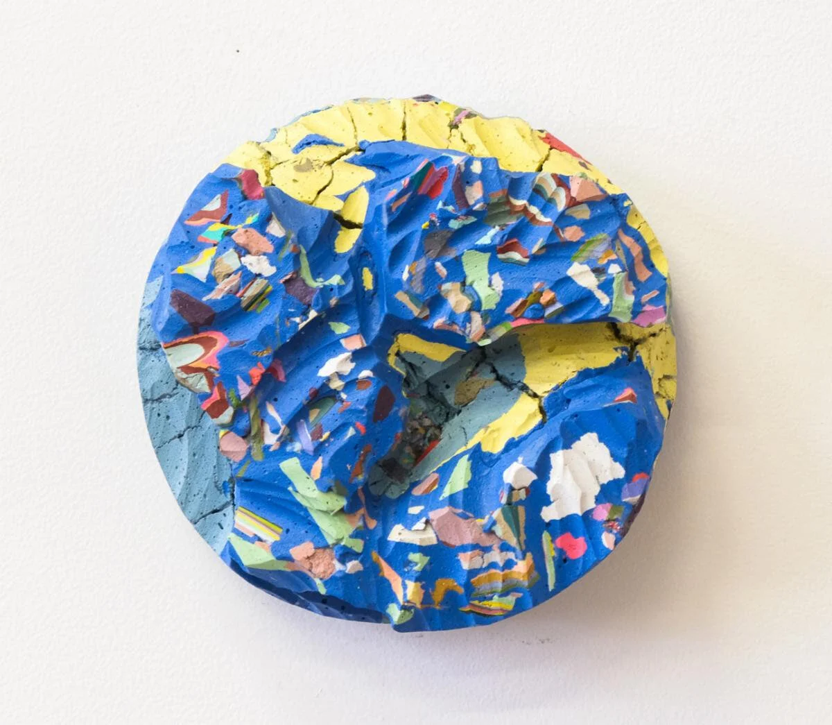 “Lucekke {a surname} Conglomerate” (paint, gypsum powder, resin), by John V. Ralston, in the “New England Regional Collective ‘‘ show at Galatea Fine Art, Boston, Aug. 6-Aug. 29