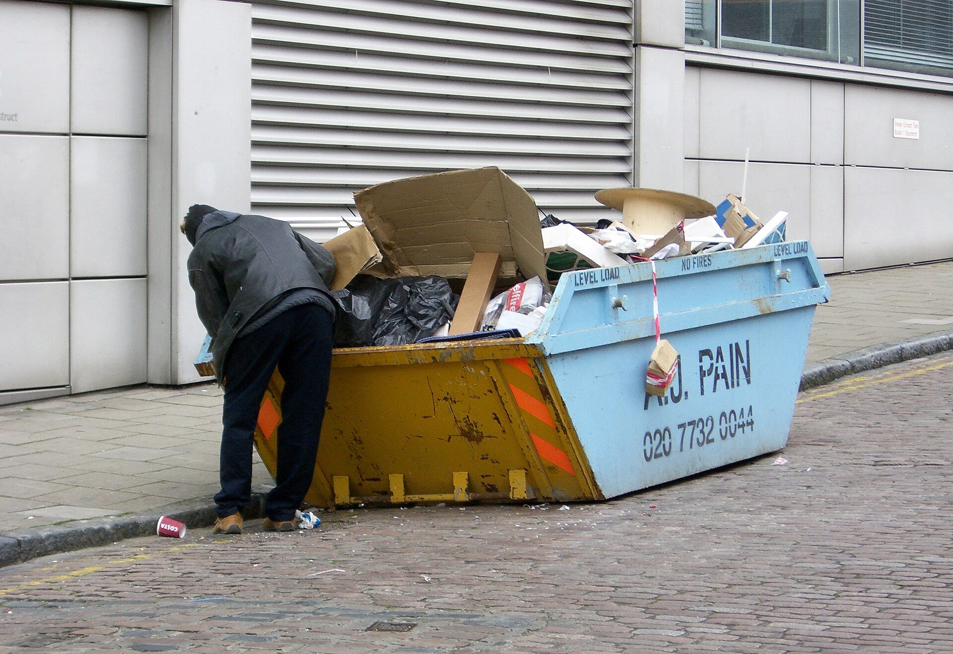 Man_rummaging_thought_a_skip.jpg