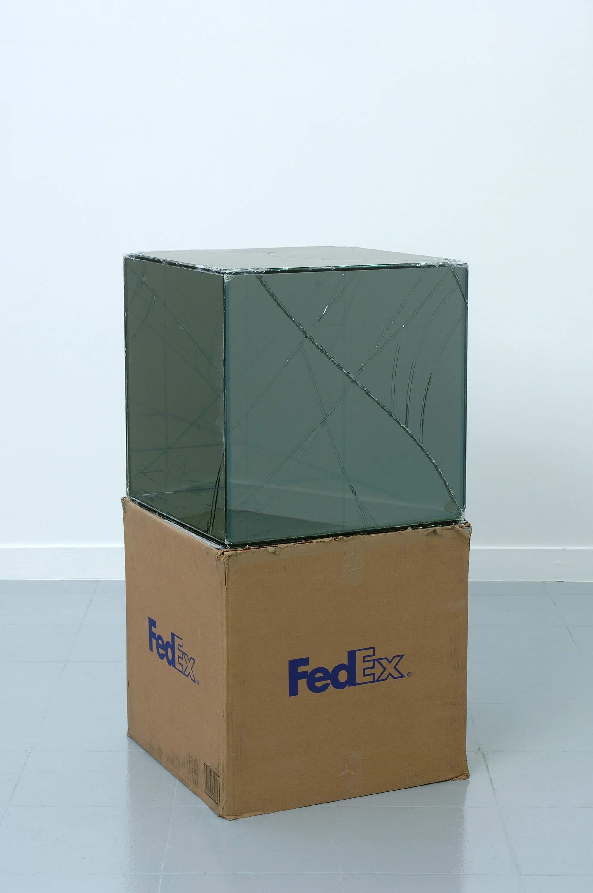 FedEx® Large Kraft Box © 2005 FEDEX 330508 REV 10/05 SSCC, International Priority, Los Angeles–Brussels trk#865282057942, October 27–30, 2008 2008– Laminated Mirropane, FedEx shipping box, accrued FedEx shipping and tracking labels, silicone, metal, and tape 20 x 20 x 20 inches FedEx Glass Works, 2007–