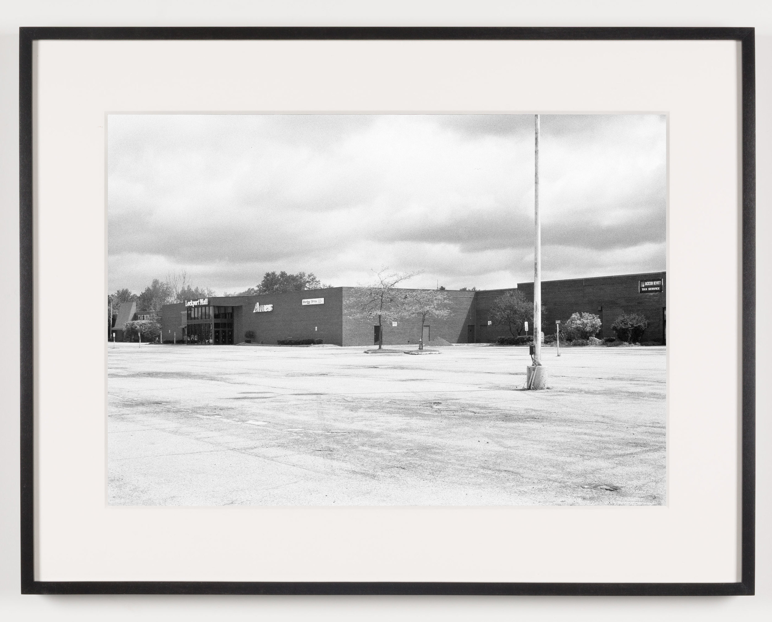   Lockport Mall (View of Exterior), Lockport, NY, Est. 1971, Demo. 2011    2011   Epson Ultrachrome K3 archival ink jet print on Hahnemühle Photo Rag paper  21 5/8 x 28 1/8 inches  Exhibition:   A Diagram of Forces, 2011  