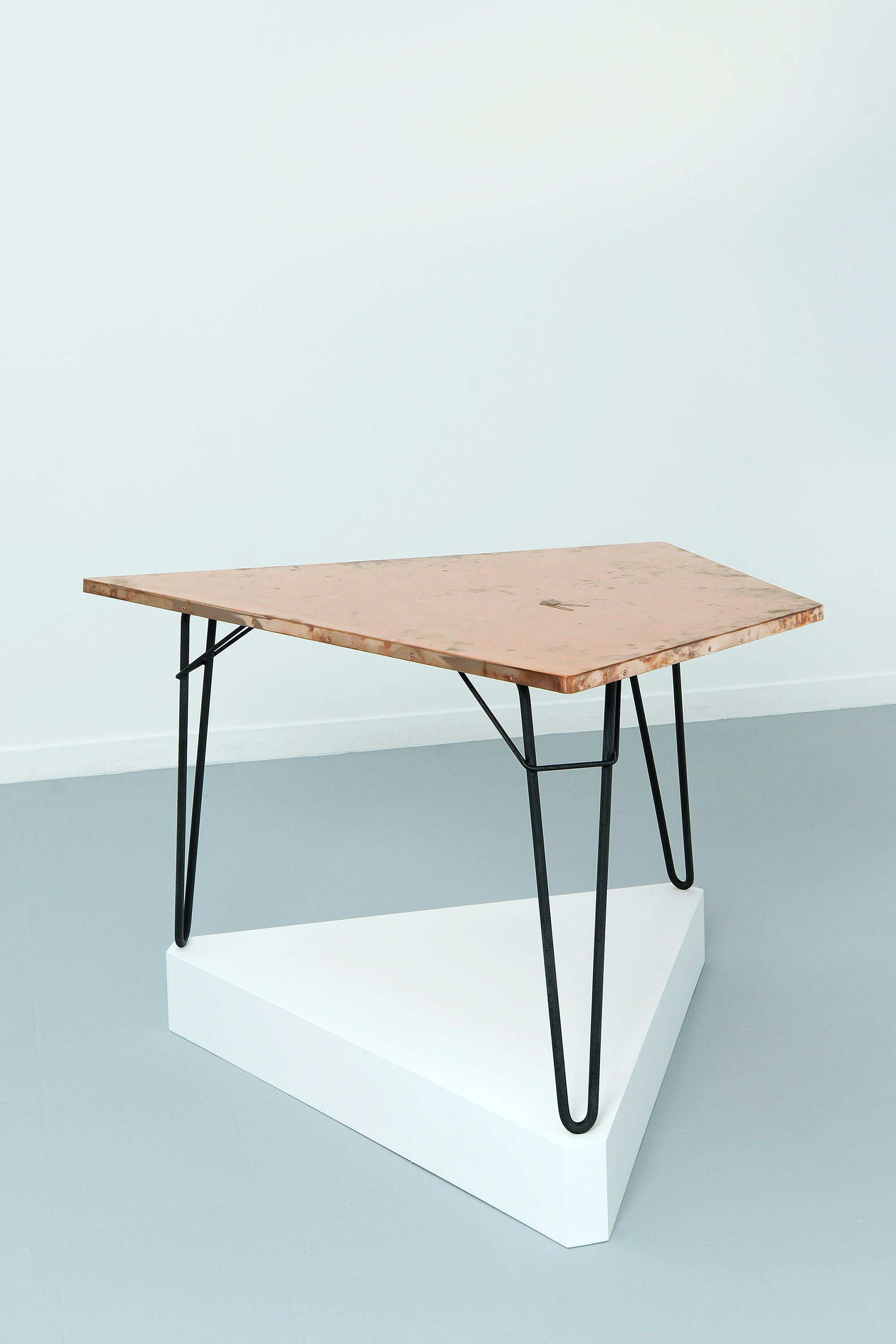   Copper Surrogate (Table: designed by Willy Van der Meeren, 1958; Galerie Rodolphe Janssen, Brussels, Belgium, August 10th–September 2nd, 2011)   2011  Polished copper table top and powder-coat steel  Table: 39 3/4 x 26 1/2 x 1 inches   Surrogates (