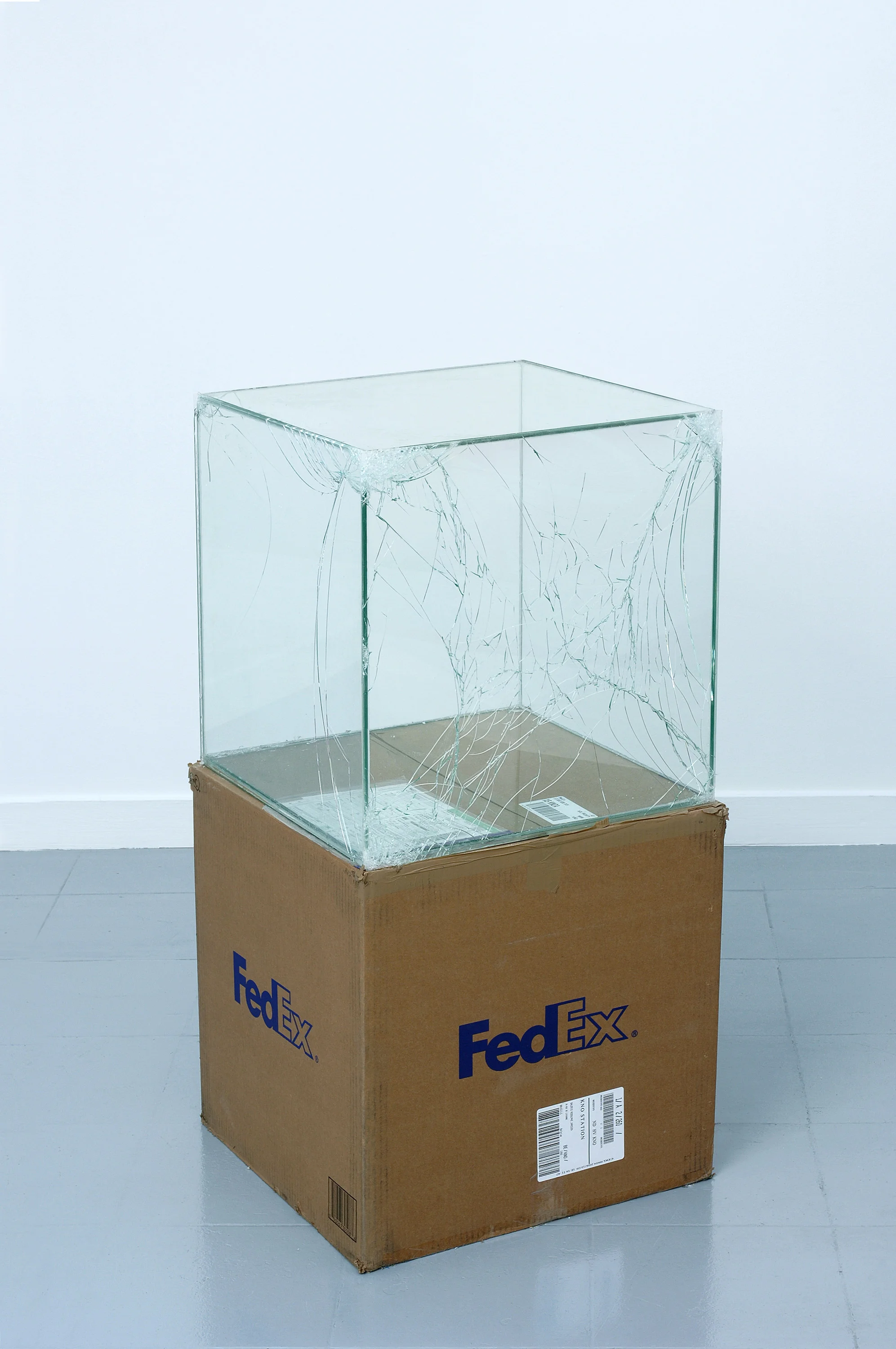 FedEx® Large Kraft Box © 2005 FEDEX 330508 REV 10/05 SSCC, International Priority, Los Angeles–Brussels trk#865282057964, October 27–30, 2008, International Priority, Brussels–Los Angeles trk#866071746385, Janurary 8–9, 2009, Standard Overnight, Los Angeles–New York trk#872632033108, April 29–30, 2010, Standard Overnight, New York–Los Angeles trk#796210730703, September 2–3, 2010, Priority Overnight, Los Angeles–New York trk#794583197877, March 28–29, 2011, Priority Overnight, New York–Los Angeles trk#611849858596, January 13–14, 2015 2008– Laminated glass, FedEx shipping box, accrued FedEx shipping and tracking labels, silicone, metal, and tape 20 x 20 x 20 inches FedEx Glass Works, 2007– Industrial Pictures, 2008