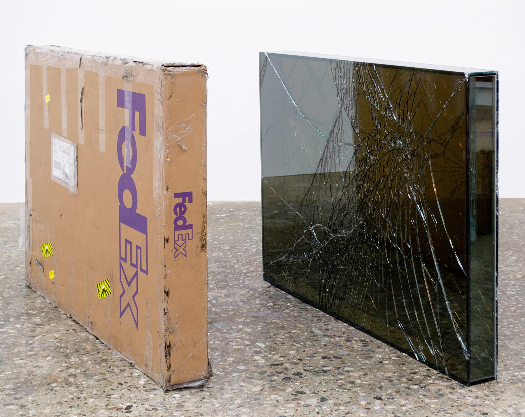 FedEx® Large Framed Art Box © 2011 FedEx 163098 REV 7/11 Standard Overnight, Los Angeles–New York trk#793767809895, July 10–11, 2012, Standard Overnight, New York–Los Angeles trk#798598422030, July 11–12, 2012 2012– Laminated Mirropane, FedEx shipping box, accrued FedEx shipping and tracking labels, silicone, metal, tape 36 11/16 x 49 3/8 x 4 3/4 inches