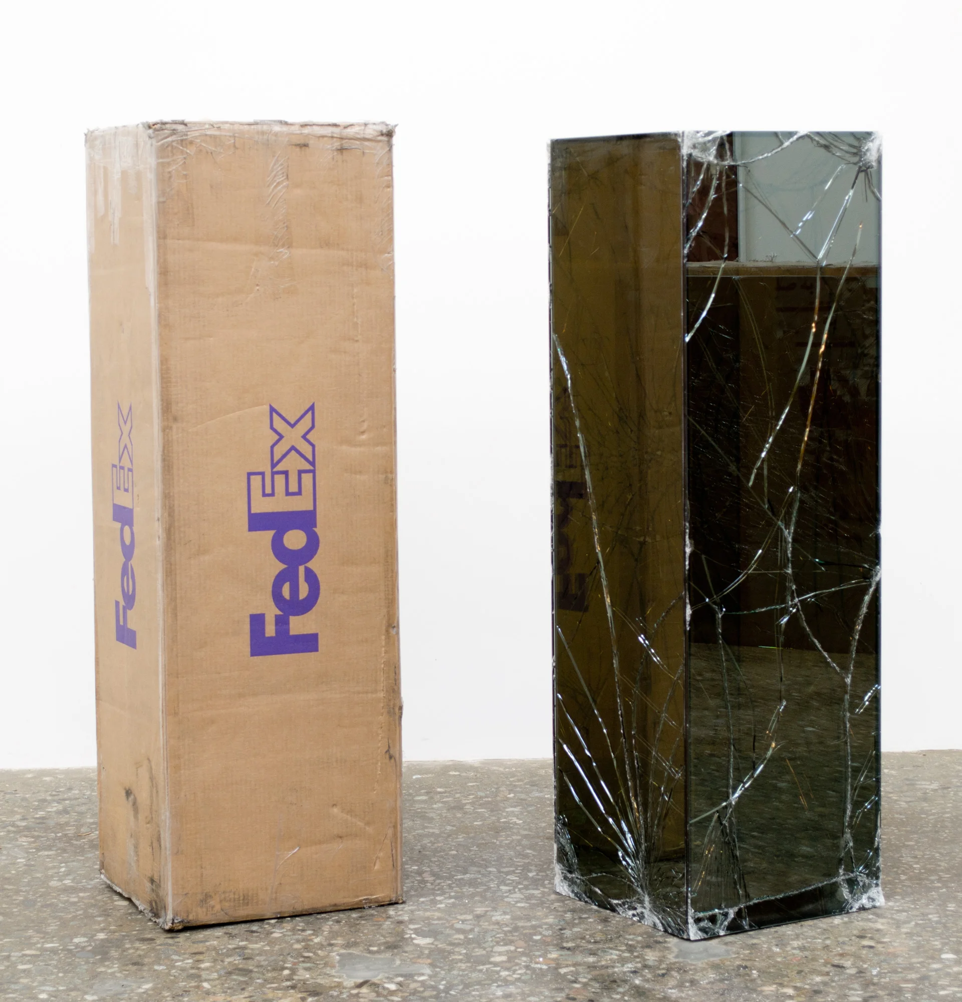 FedEx® Golf-Bag Box © 2010 FedEx 163166 REV 10/10 Standard Overnight, Los Angeles–New York trk#793767865564, July 10–11, 2012, Standard Overnight, New York–Los Angeles trk#793767890360, July 11–12, 2012 2012– Laminated glass, FedEx shipping box, accrued FedEx shipping and tracking labels, silicone, metal, tape 48 x 15 x 15 inches